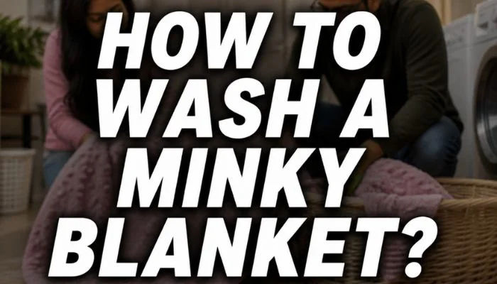 how to wash a minky blanket feature image with a couple handling a soft blanket near the washing machine